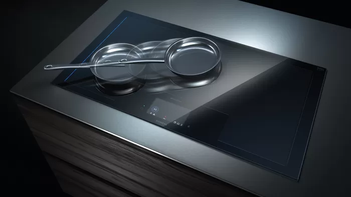 Auriculares elegantes y modernos sobre una superficie oscura y reflectante, creando un contraste visual llamativo.